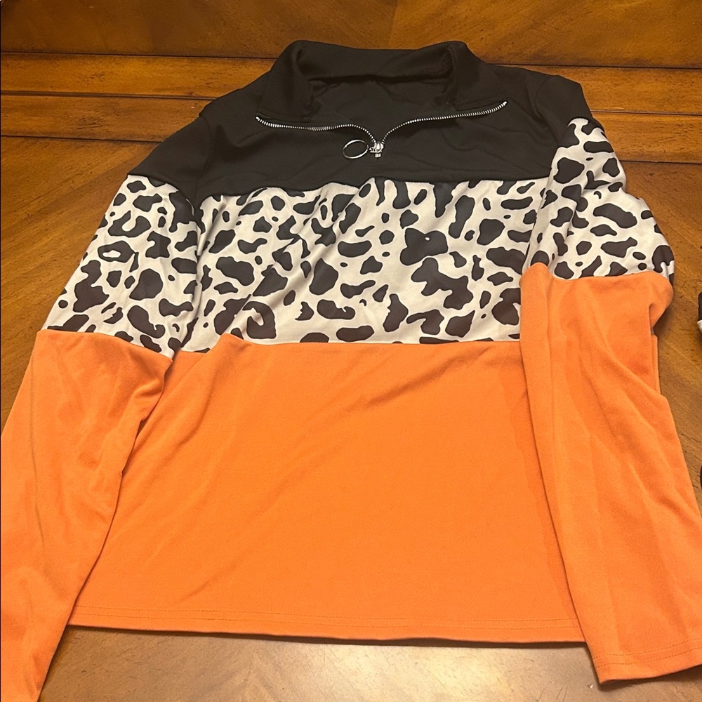 Orange and Black Animal Print Quarter-Zip Pullover and matching pants.